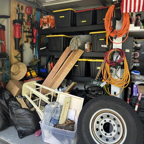 Garage packed with junk before an Eco Haul cleanout