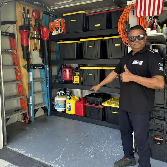 The same garage cleared out, with the Eco Haul crew